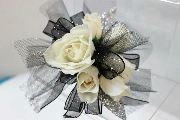 WHITE ROSE CORSAGE WITH BLACK TULLE